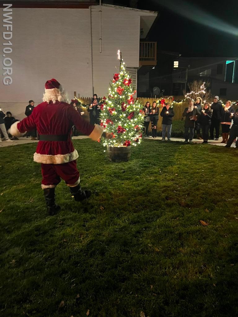 Santa Claus lighting the Town Tree 